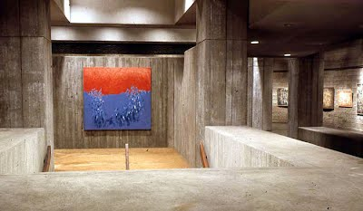 Norman Lewis paintings installed around a concrete stair landing